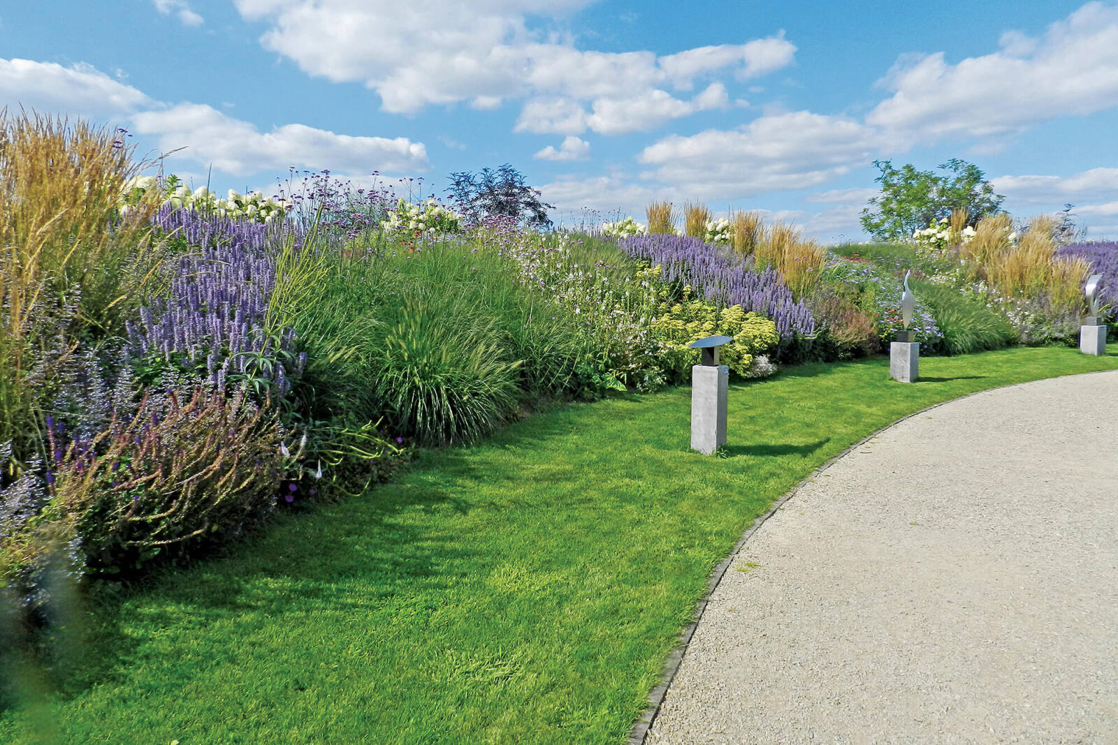 A nice display of various perennials next to a path