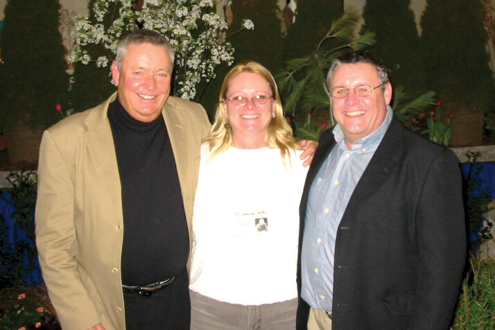 two men and a woman