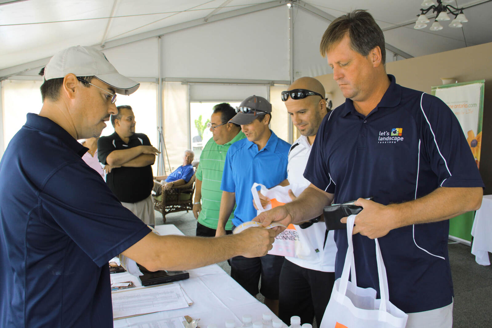golfer checking in at a registration desk