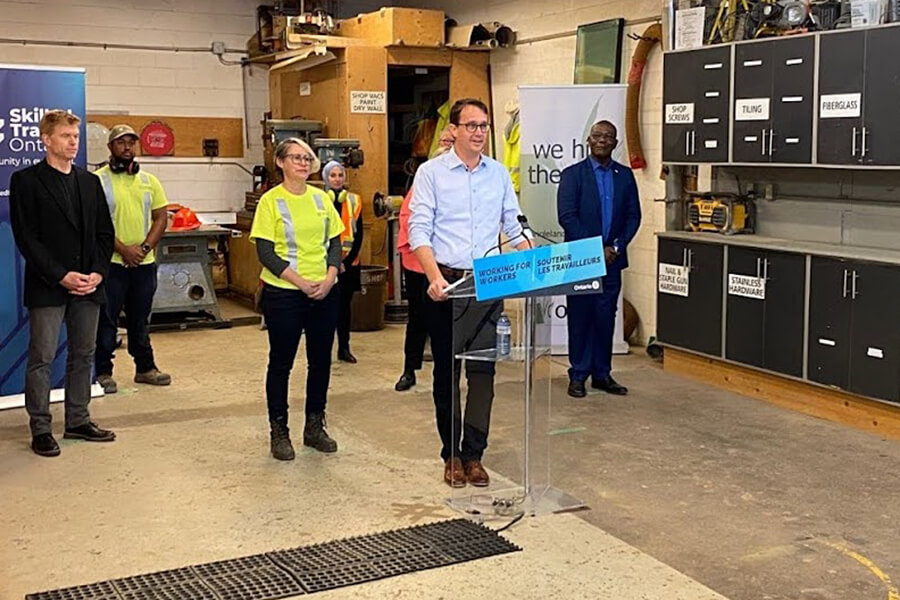 man at a podium making an annoucement