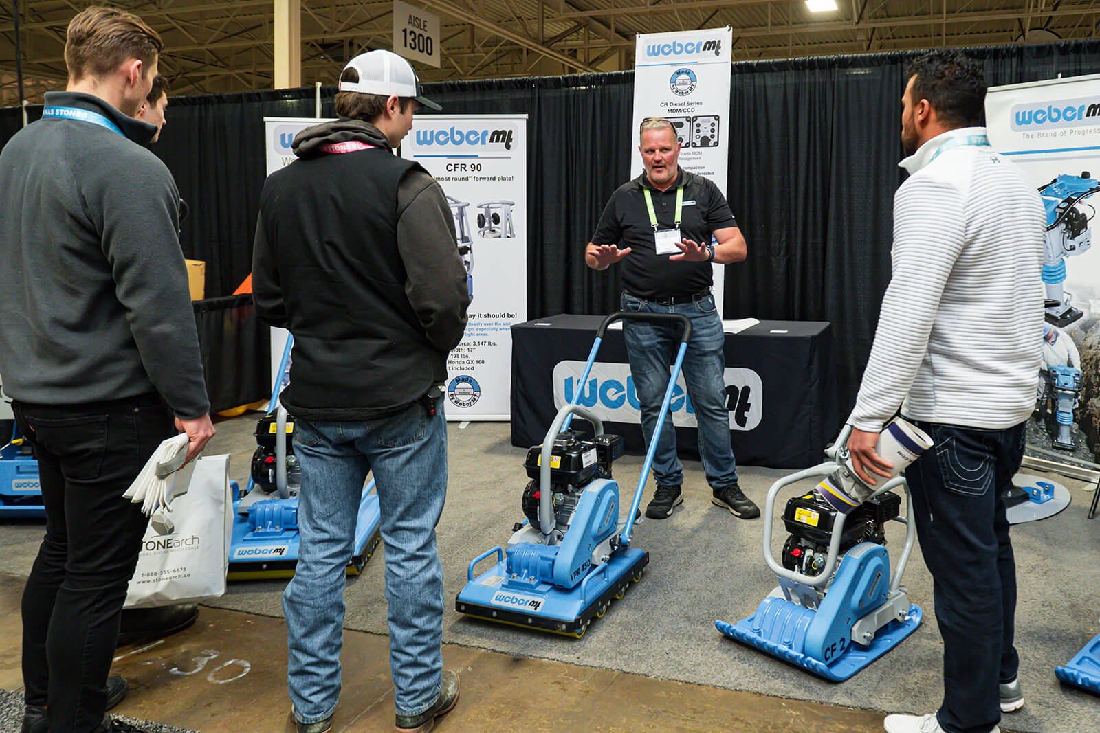 man demonstrating a piece of equipment